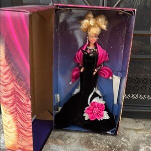 Elegant Black and Pink Doll with Floral Accent